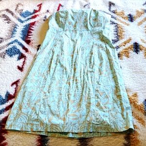 Light blue and tan floral strapless dress.